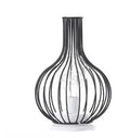 Minimalist hollow iron table lamp in wine bottle design with warm white LED lighting