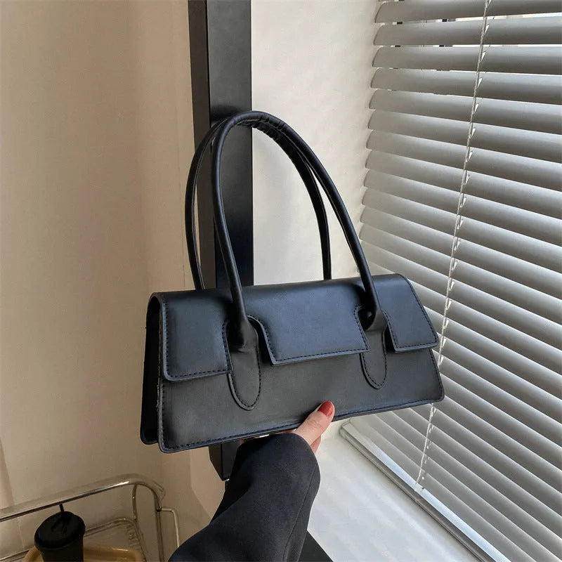 Women's small square bag in horizontal shape with single shoulder strap and document organisation interior