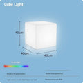 Modern square white LED cube stool light for garden patio with solar panel on top.