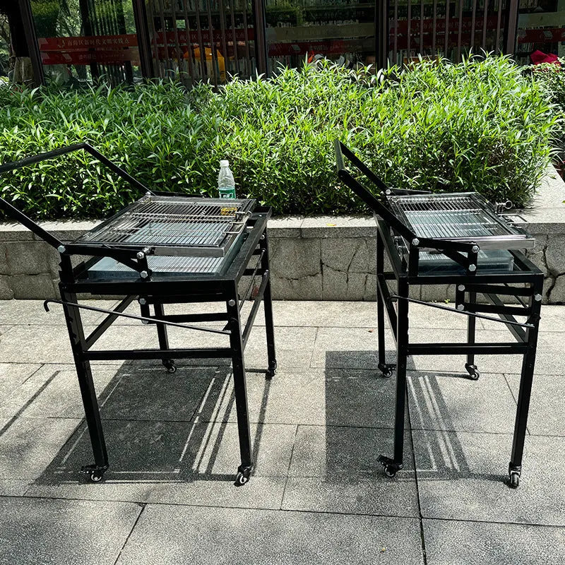 Large foldable portable charcoal BBQ grill oven for outdoor garden use.