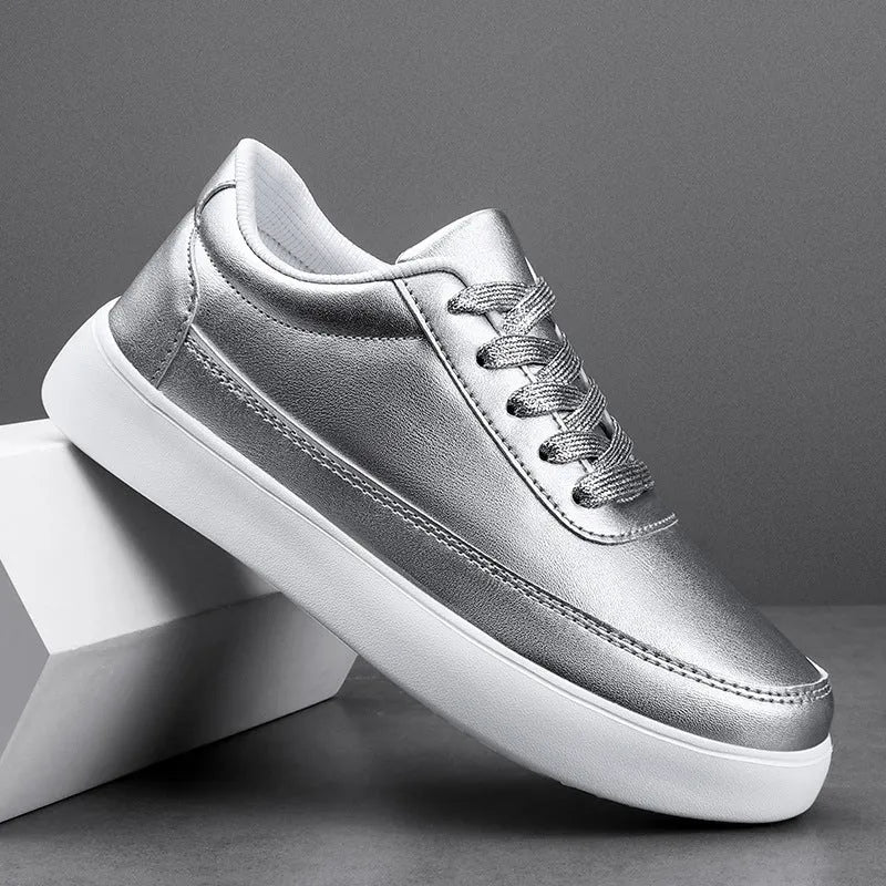Women's gold leather lace-up casual flat shoes on a white background, showing front and side views.