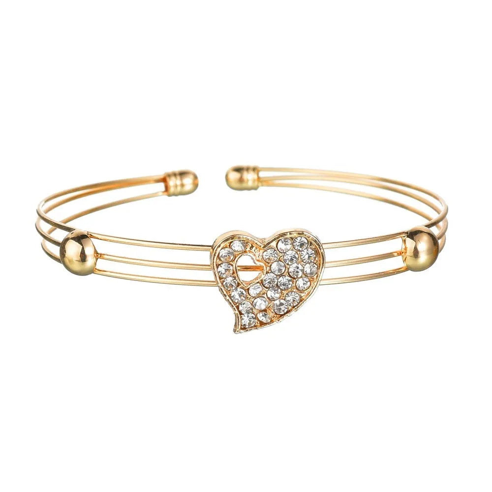 Gold electroplated alloy jewellery set with earrings, pendant necklace and bracelet for women