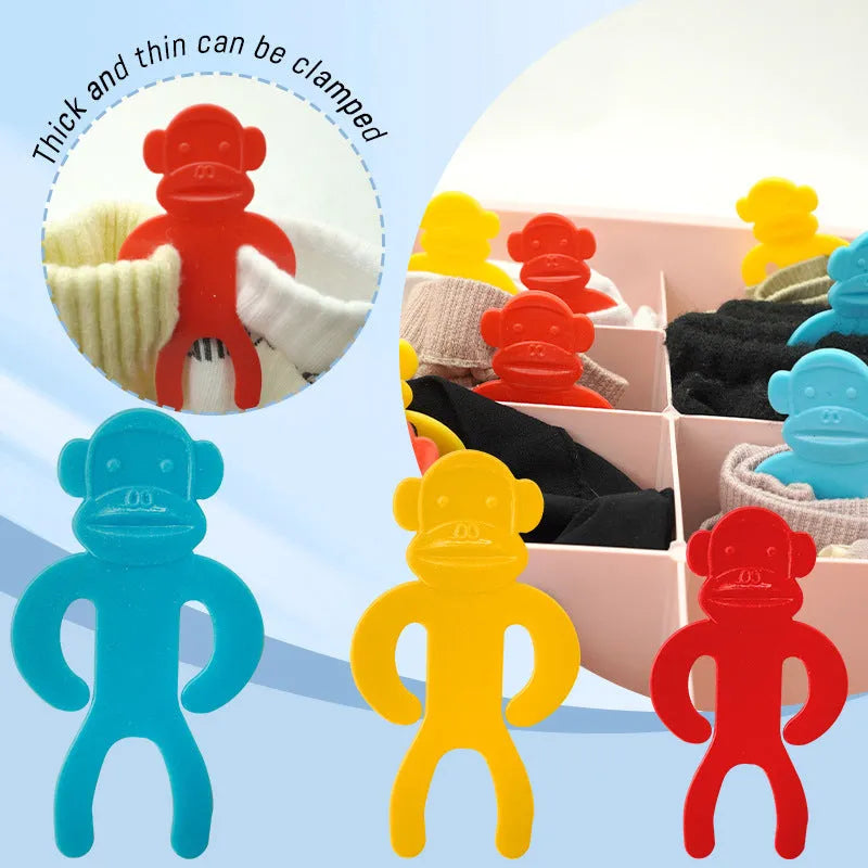 Plastic sock clips in blue, red, and yellow colours for laundry organisation