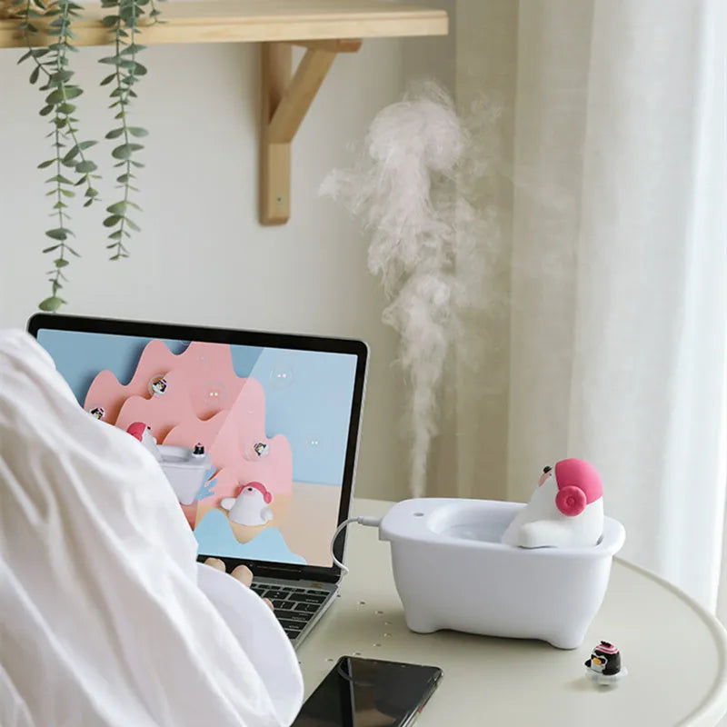 White USB-powered desktop air humidifier with 550ml water tank on a desk