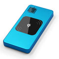 Silver portable power bank with LCD display showing battery percentage, placed next to a mobile phone.