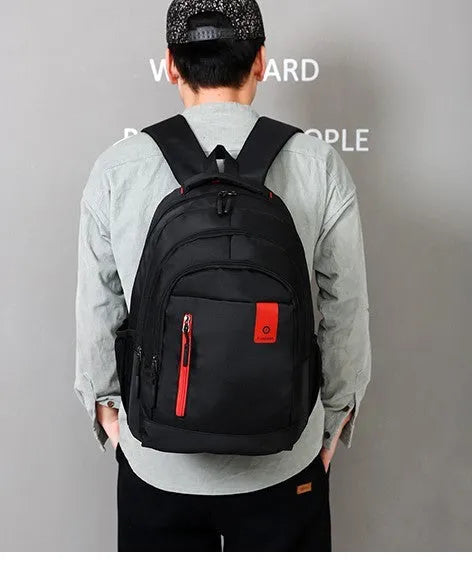 Blue Oxford fabric backpack for teenagers with breathable straps and side pockets