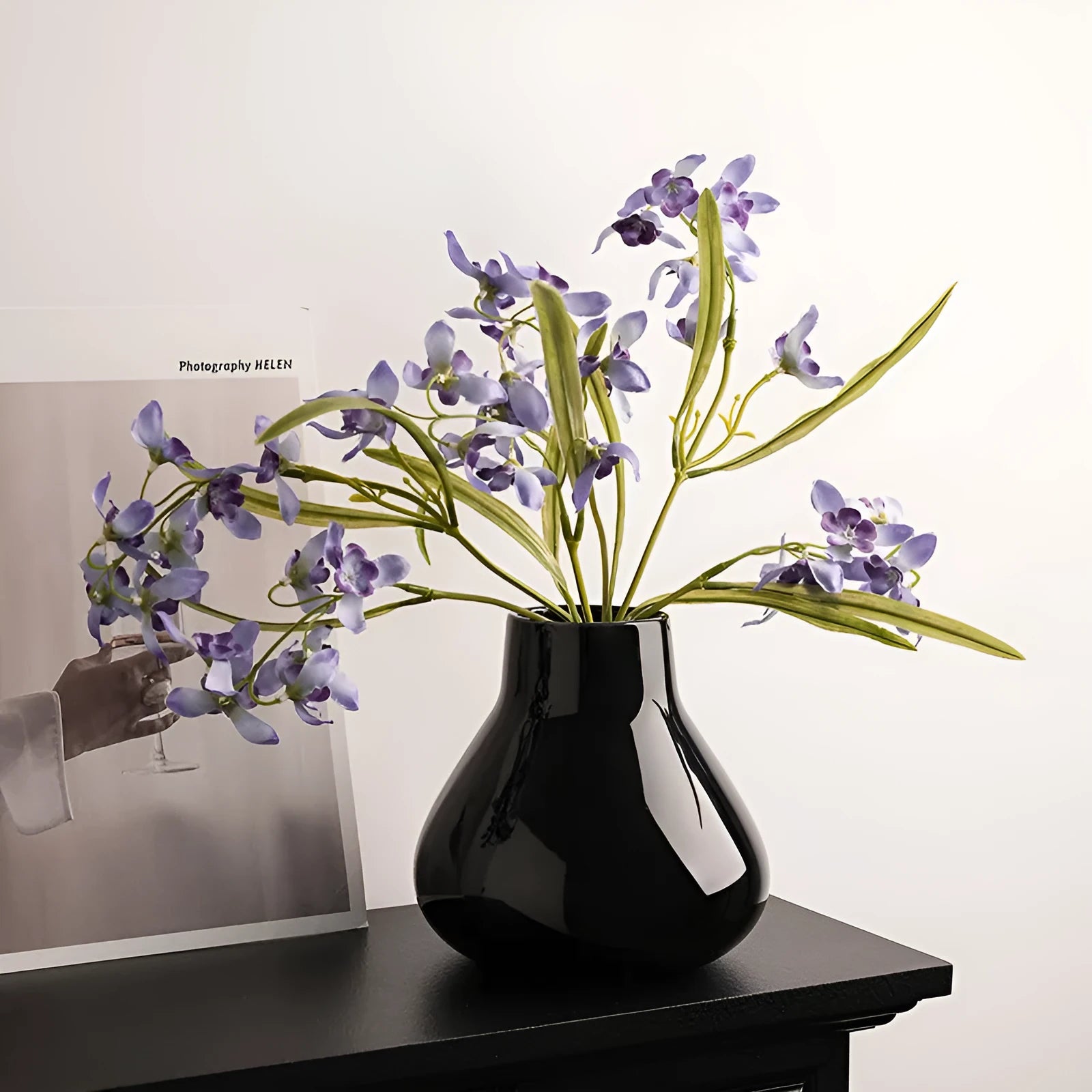 Ceramic decorative vase with artificial orchid flowers in black or white colour options