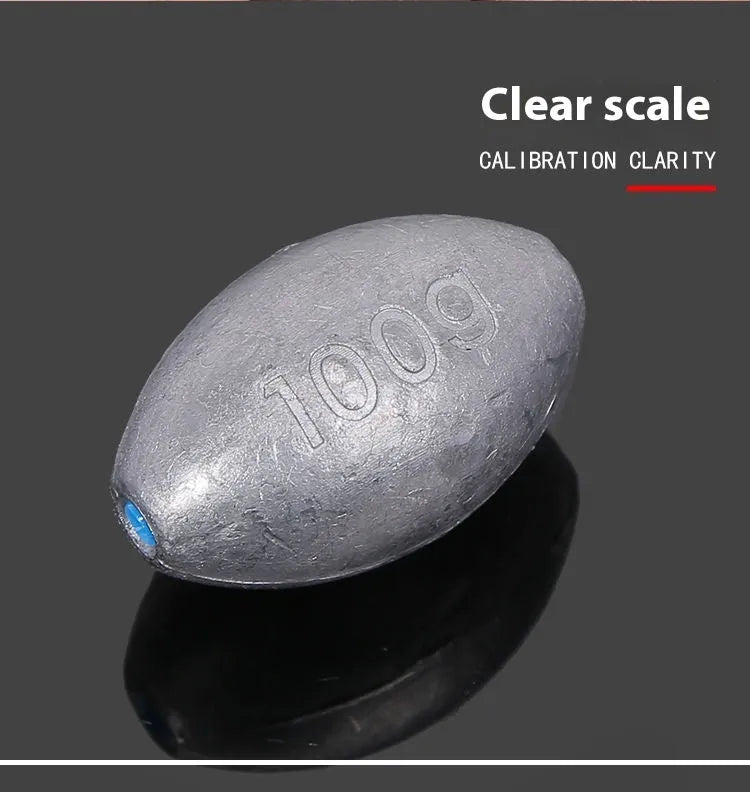 Rugby-shaped olive lead fishing sinker with scale texture pattern and plastic core construction