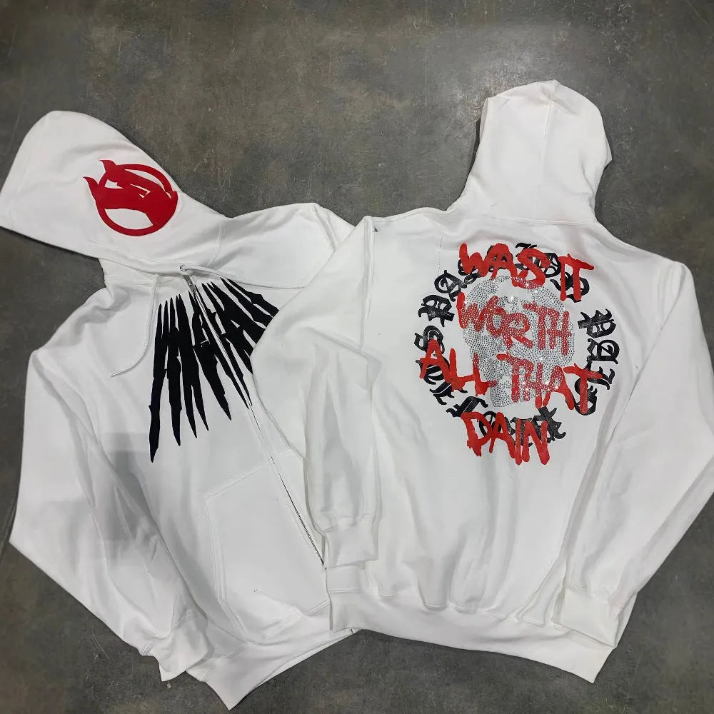 Black loose hooded sweatshirt with white skull print and rhinestone details on the front