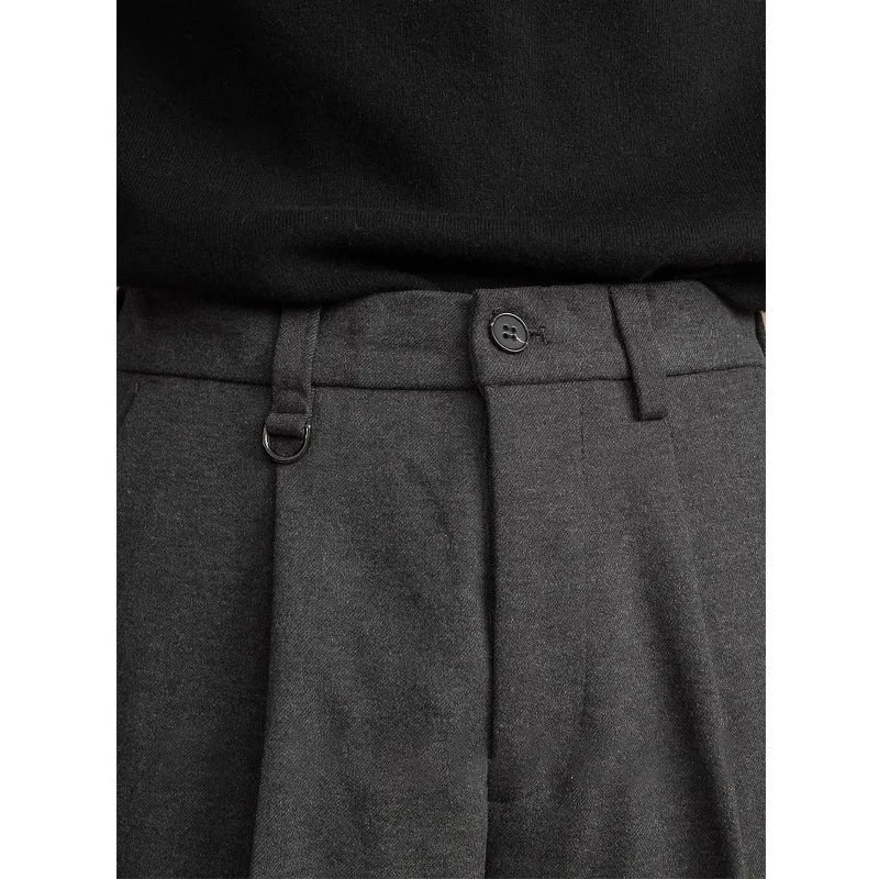Men's straight-leg trousers in khaki colour on a hanger