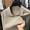 Man wearing a loose-fit camel coloured pullover sweater, casual autumn style