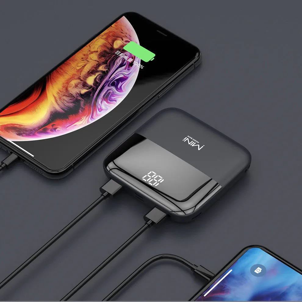 Black 10000mAh portable power bank with digital display showing battery percentage and dual USB ports.