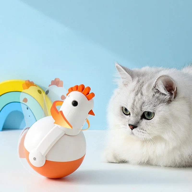 Green or orange electric chicken cat toy with laser light and sound functions on a flat surface