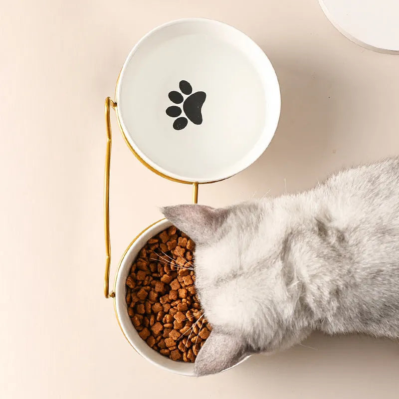 White ceramic cat bowl with decorative pattern on iron frame with cat ear accents