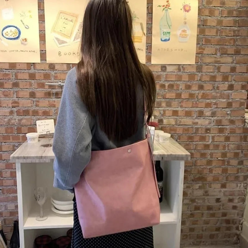 Corduroy commuter shoulder bag in pink or brown with PU lining and single strap