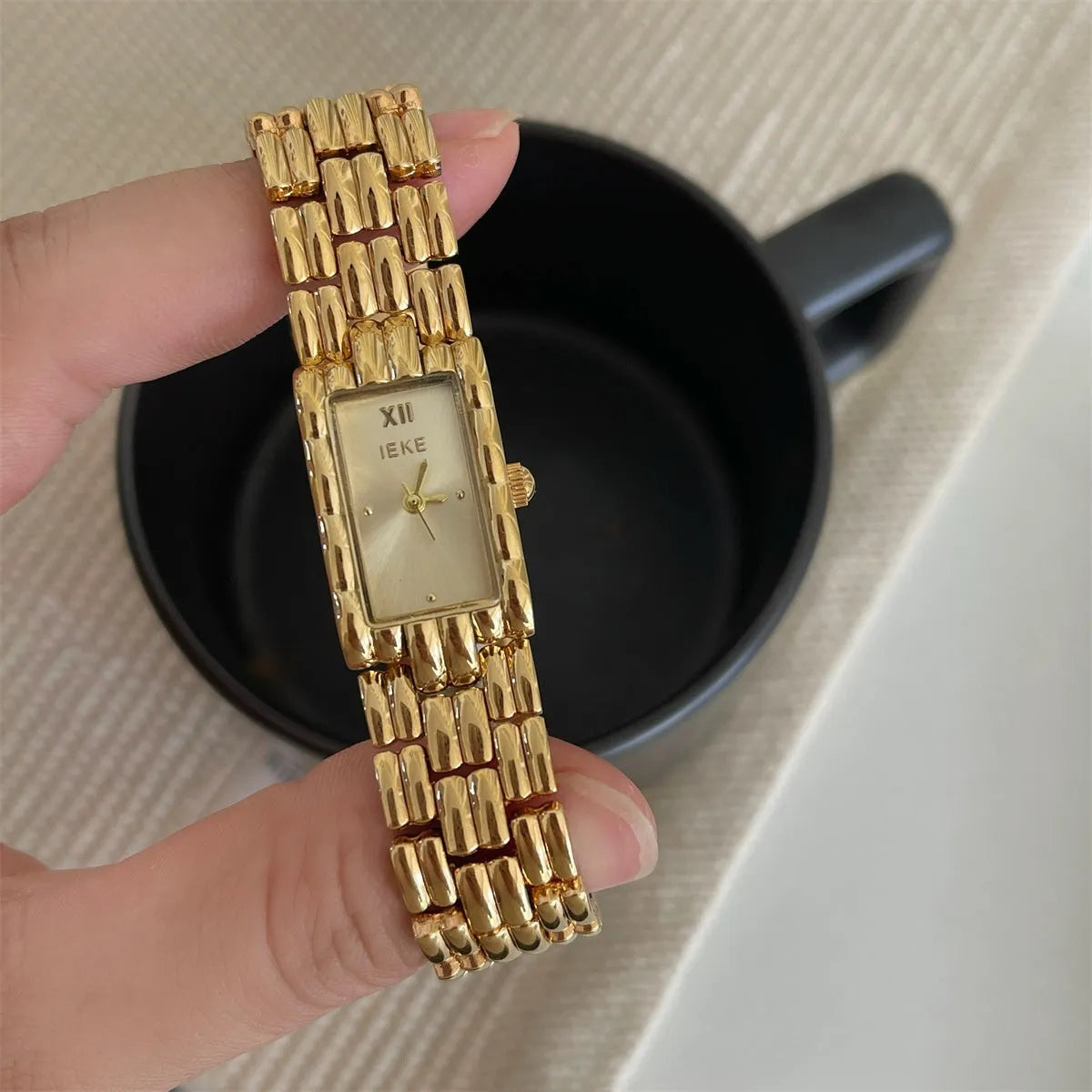 Women's silver and gold bracelet-style analogue watches with 15mm dials and butterfly clasps