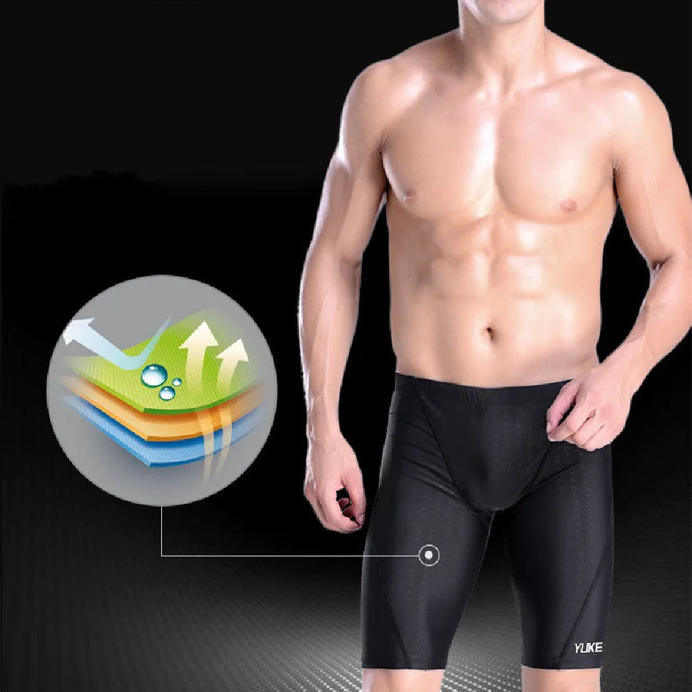 Men's black swimming set with trunks, anti-fog goggles, waterproof cap, ear plugs with nose clip, and storage bag