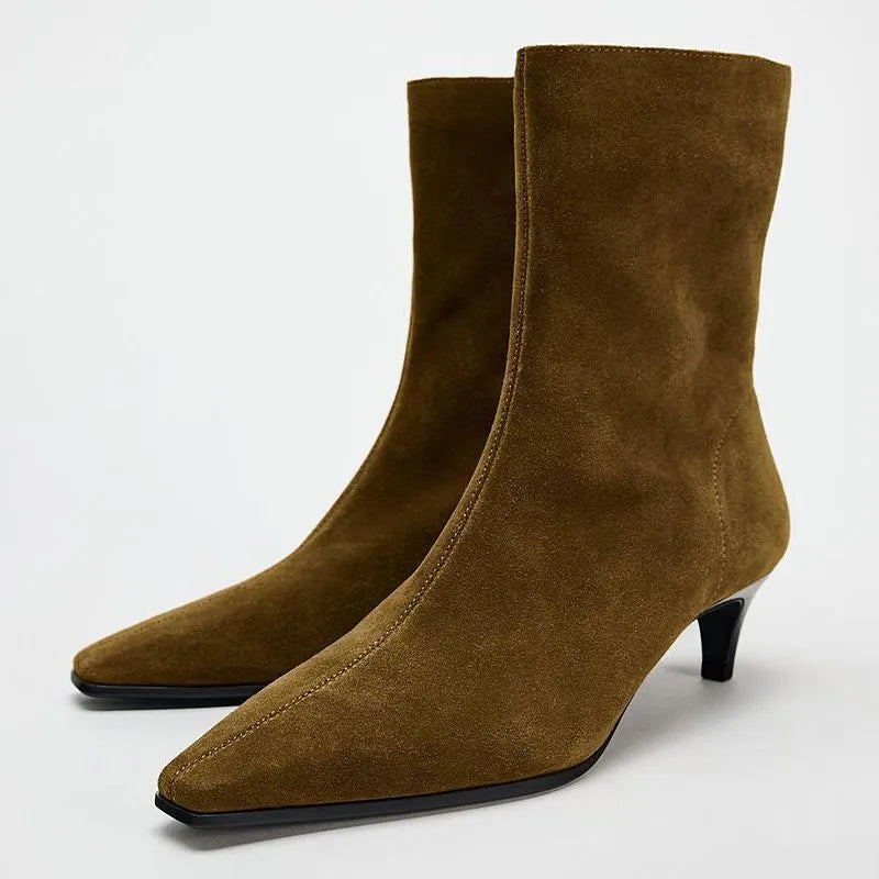 Brown women's square toe ankle boots with a side zip and mid kitten heel on a waterproof platform sole.