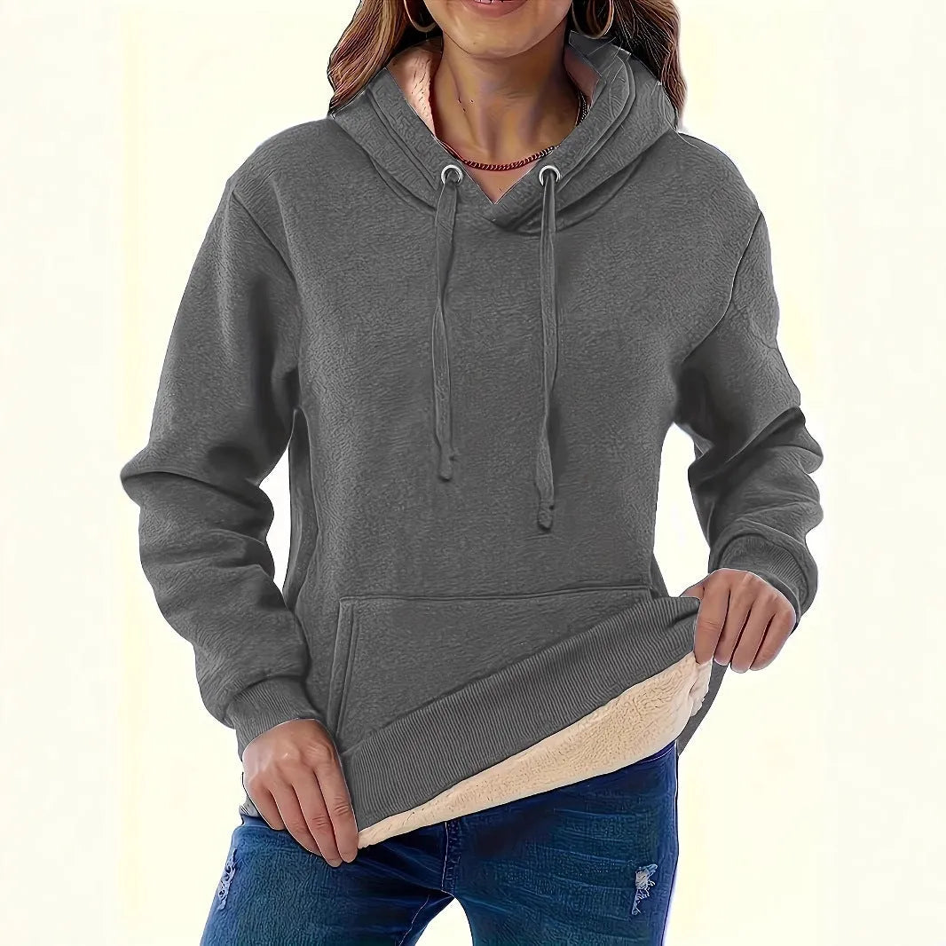 A woman's loose-fit hooded sweater with a raised 3D pattern, shown in a wine red colour.