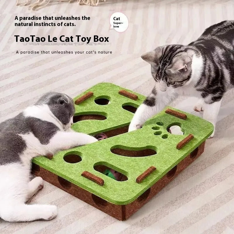 Rectangular green brown felt cat scratching box with holes, shown on a floor.