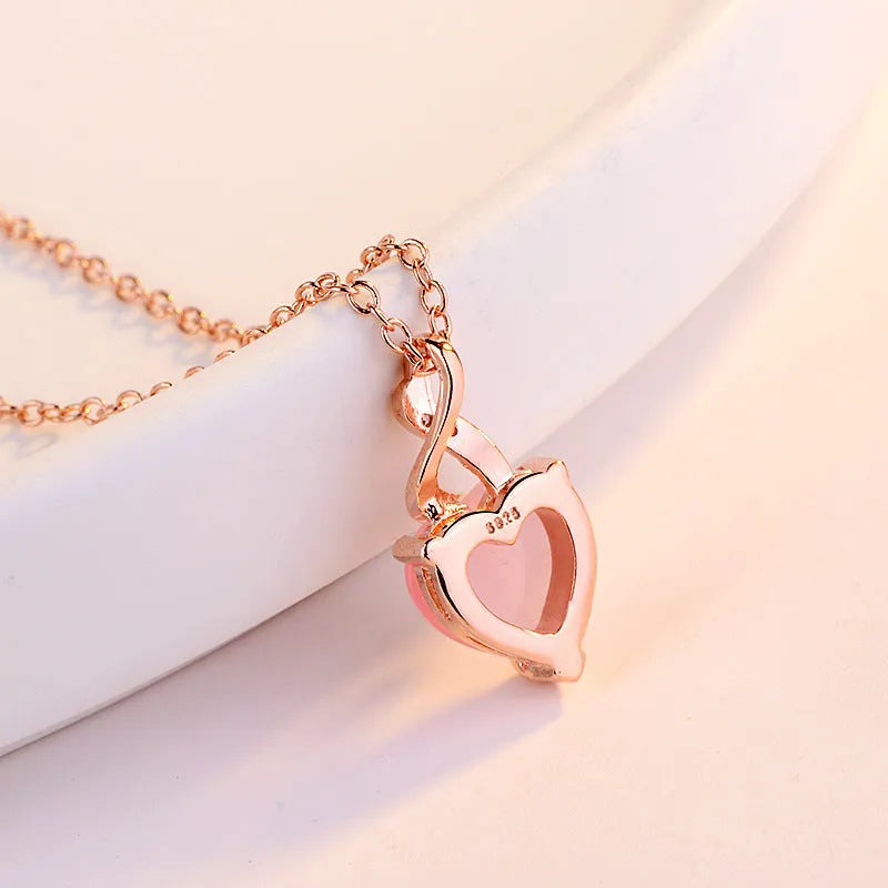 Women's heart-shaped synthetic crystal pendant necklace with rose gold cross chain