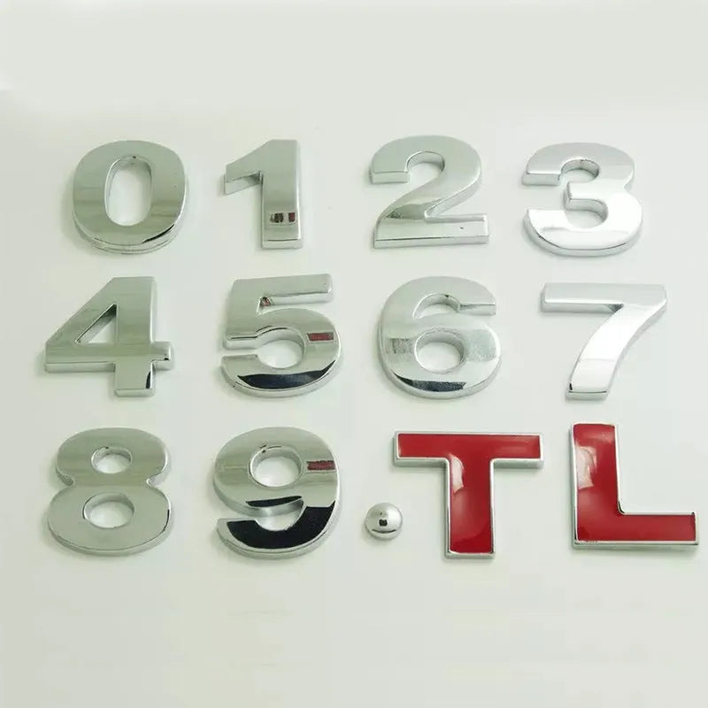Close-up of a silver metal zinc alloy 3D letter 'A' car bumper sticker, approximately 2.5cm in size.