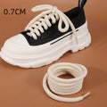 Round woven shoelaces for Bread Shoes in white, beige and black colours on a white background.