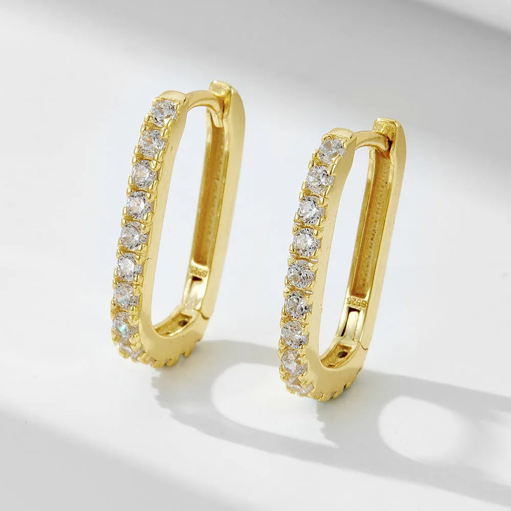 Sterling silver clip-on earrings with oval zircon stone in geometric design