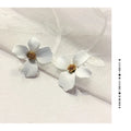 Flower-shaped alloy stud earrings for women in white or pink electroplated finish