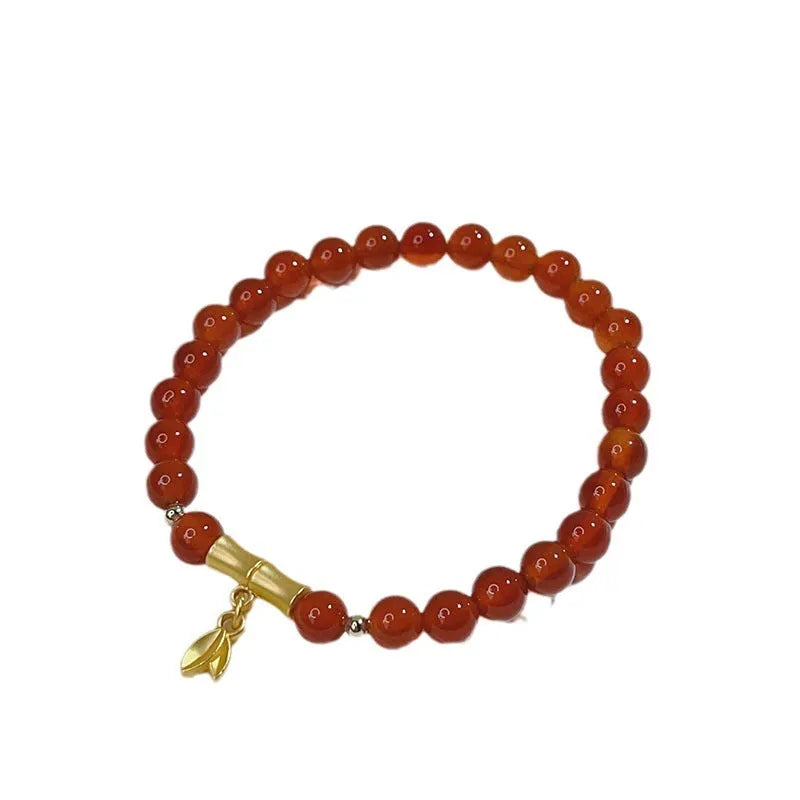 Handcrafted red agate bracelet for women with dragon charm, Chinese style design.