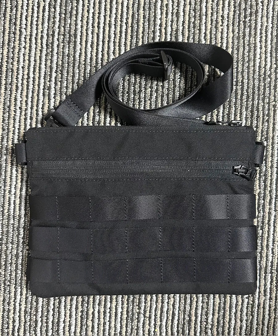 Black Oxford cloth portable outdoor kit measuring 18 by 3.5 centimetres for military enthusiasts