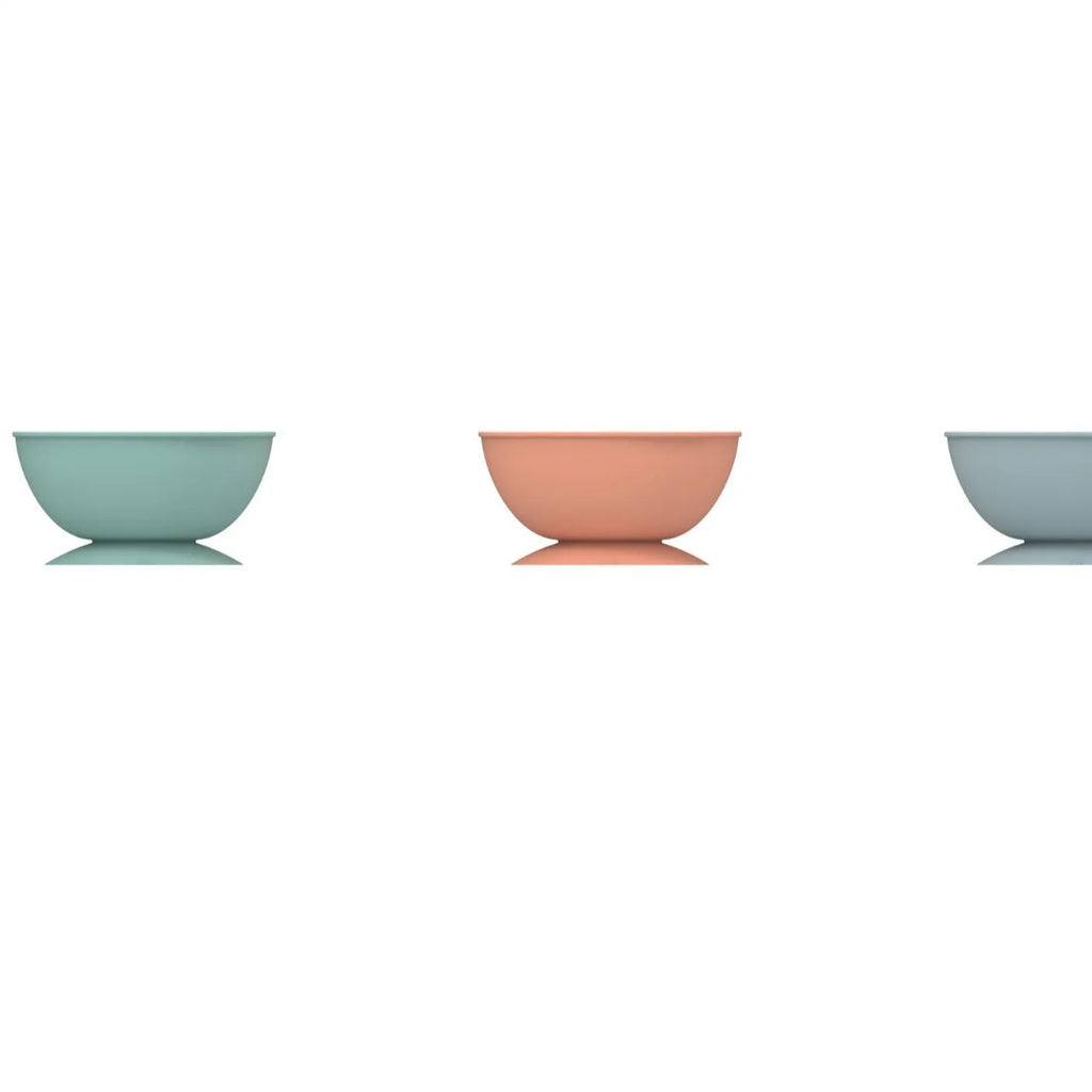 Cyan silicone pet slow feeding bowl with textured licking mat surface and suction cup base
