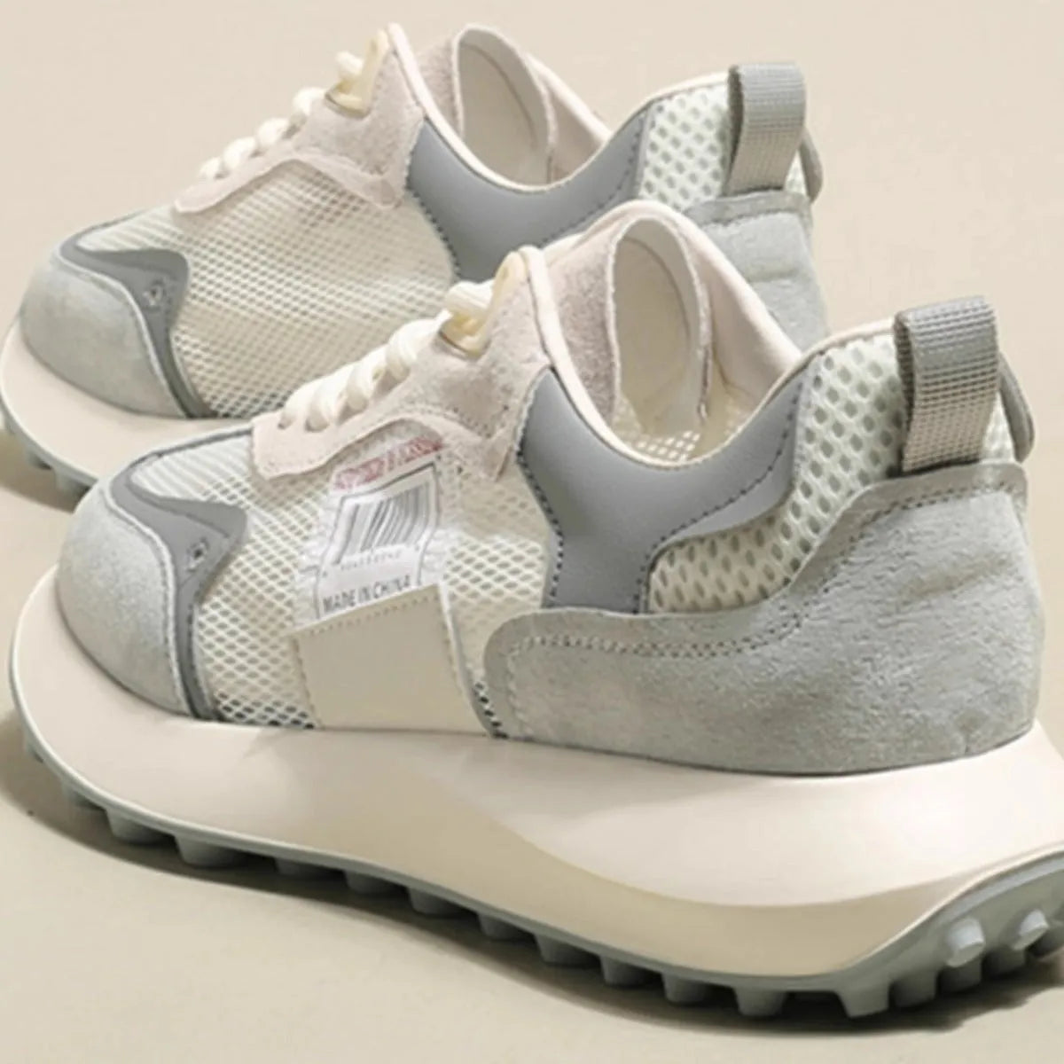 Women's grey and pink retro sneakers with rubber soles and mesh lining in low-top design