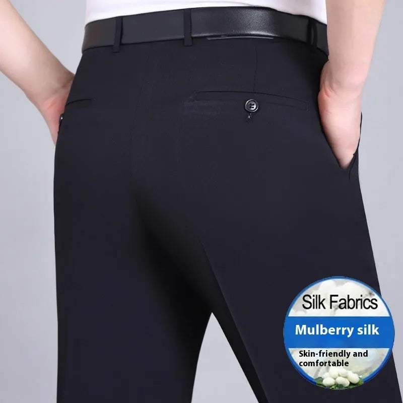 Men's straight-leg suit trousers in a dark blue colour, showing high waist and business cut.