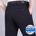 Men's straight-leg suit trousers in a dark blue colour, showing high waist and business cut.