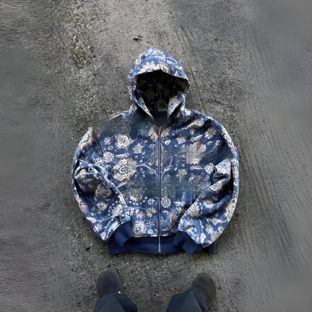 Man wearing a blue loose-fit hooded zip-up casual coat for autumn.