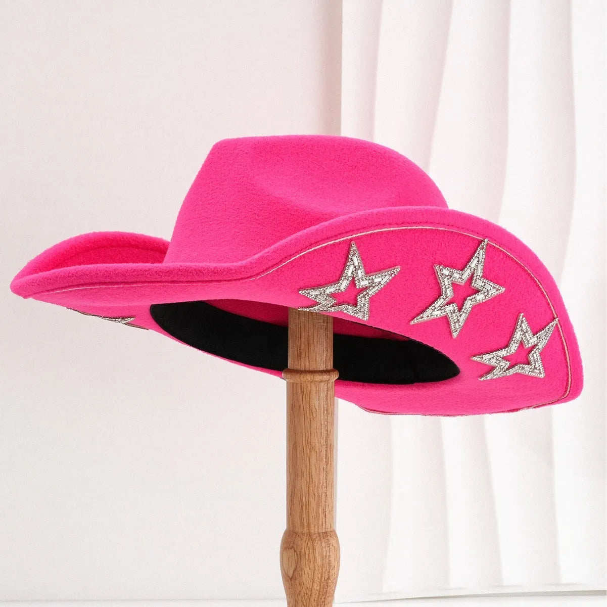 Beige polyester Western top hat with a conical crown and a silver hexagonal star decoration on the front.