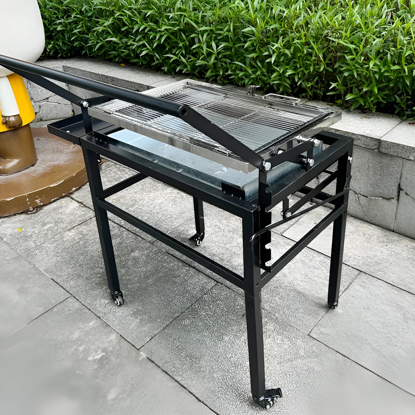 Large foldable portable charcoal BBQ grill oven for outdoor garden use.