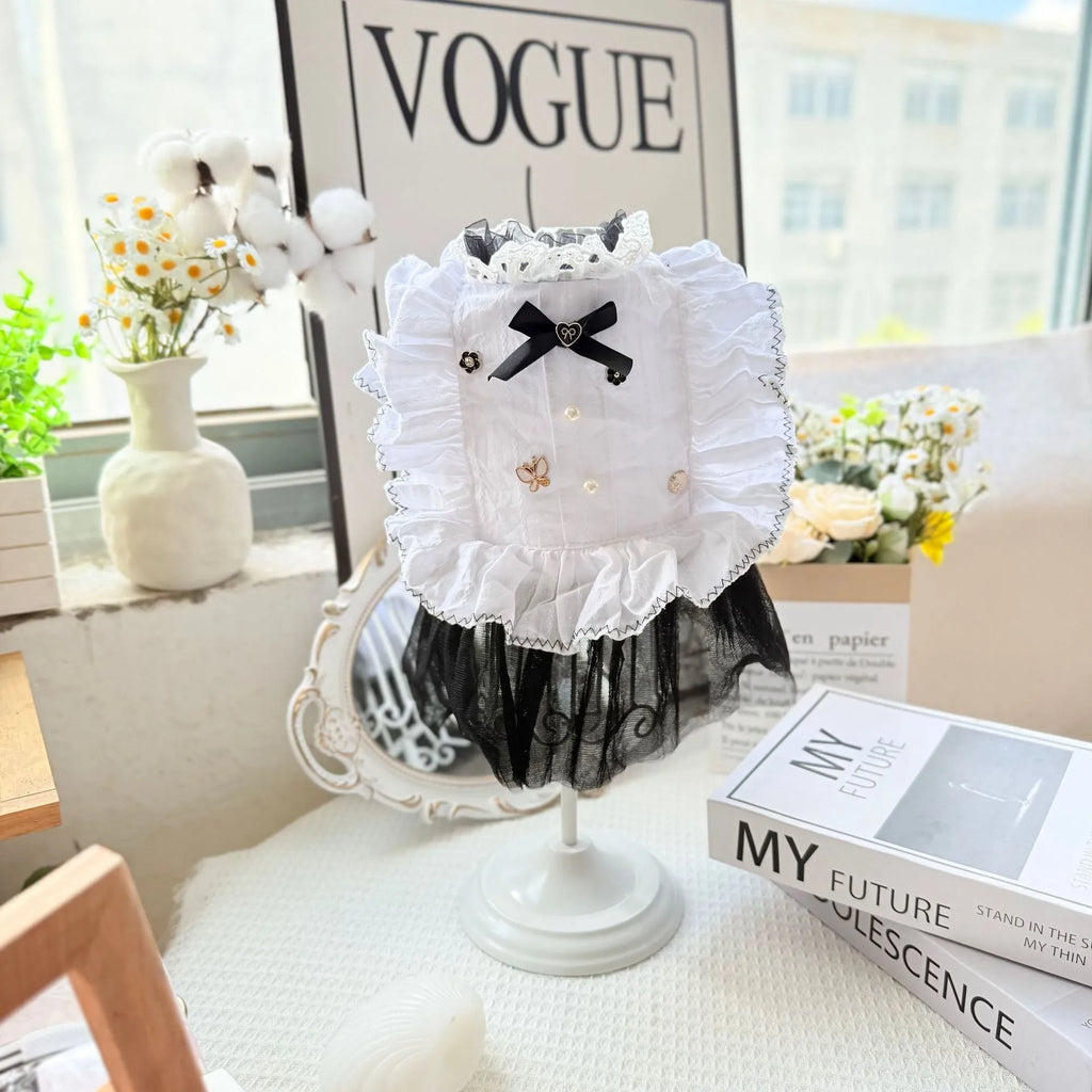 White yarn princess-style gauze skirt for small to medium dogs on mannequin showing chest and length measurements