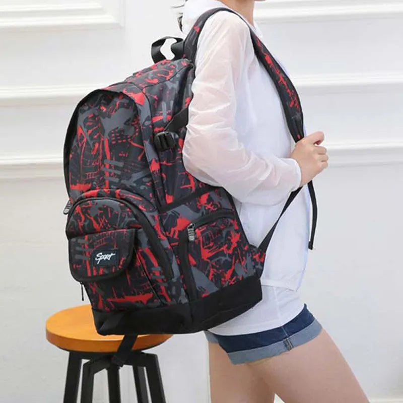 Blue and red classic nylon backpack showing large main compartment for school or travel.