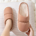 Down cotton slippers with artificial leather upper, rubber sole and plush lining in multiple colours