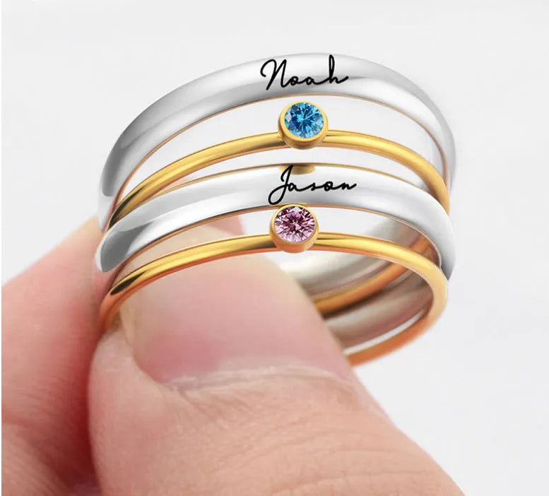 Geometric titanium steel ring with December colour birthstone and superimposed engraving.