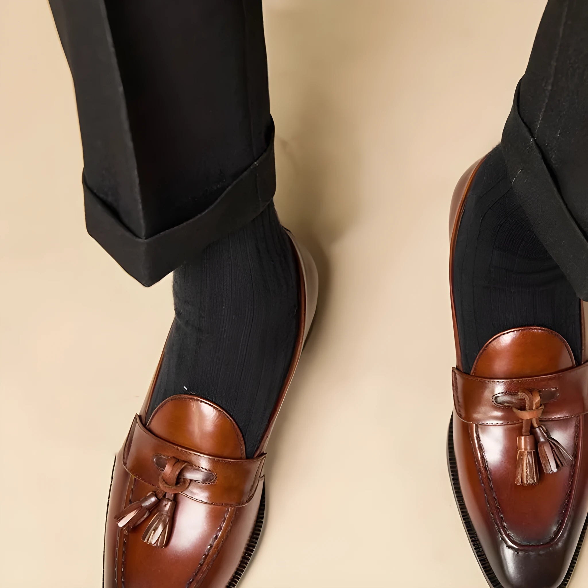 Men's black tassel loafers with genuine leather upper and British style detailing