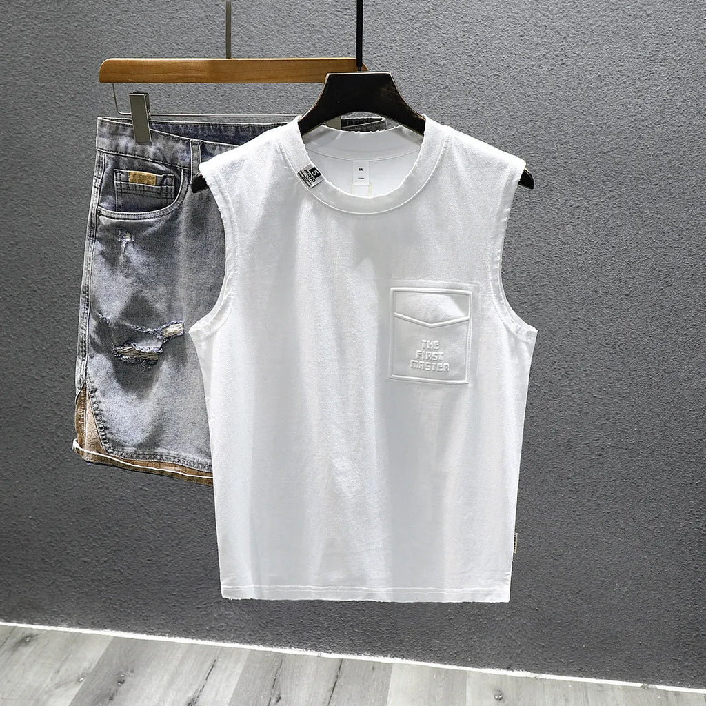 Solid colour loose cotton sleeveless t-shirt on a hanger in white or black