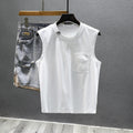 Solid colour loose cotton sleeveless t-shirt on a hanger in white or black