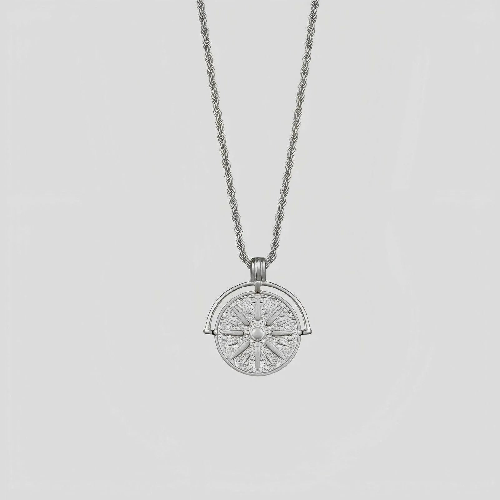 Gold titanium steel necklace with embossed sunflower pendant and geometric star elements on adjustable chain