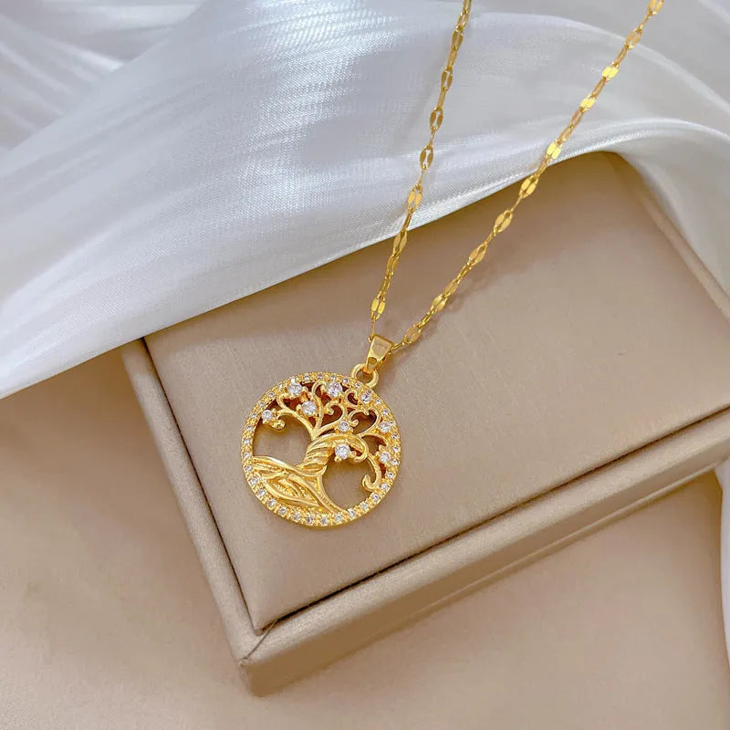Gold-plated necklace with mother-of-pearl pendant and rhinestone cross design on adjustable lip chain