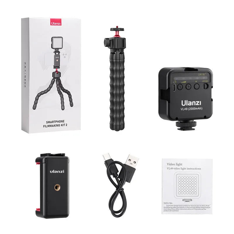 Multifunctional VLOG photography suite showing aluminium tripod and 2985-piece accessory collection.
