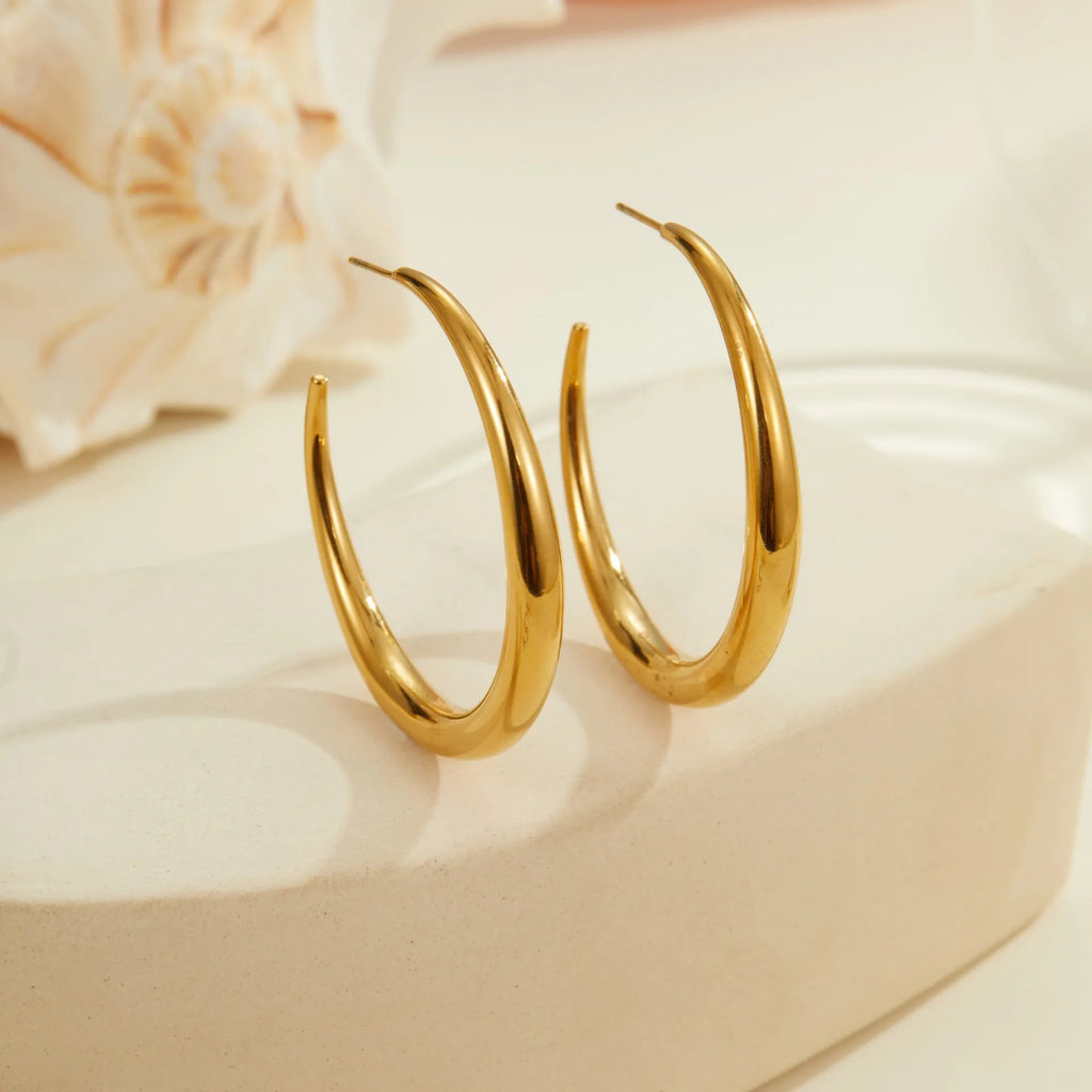Geometric round hoop earrings in gold and steel finishes available in large and small sizes