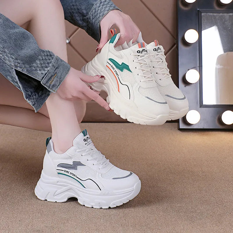 Breathable white and beige women's dad shoes with cross strap and flat rubber sole.